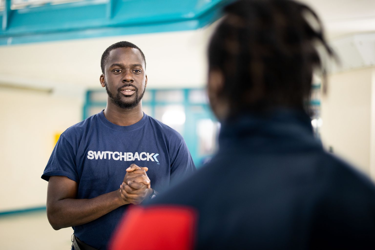 A Switchback mentor and Trainee talking together inside HMP Isis