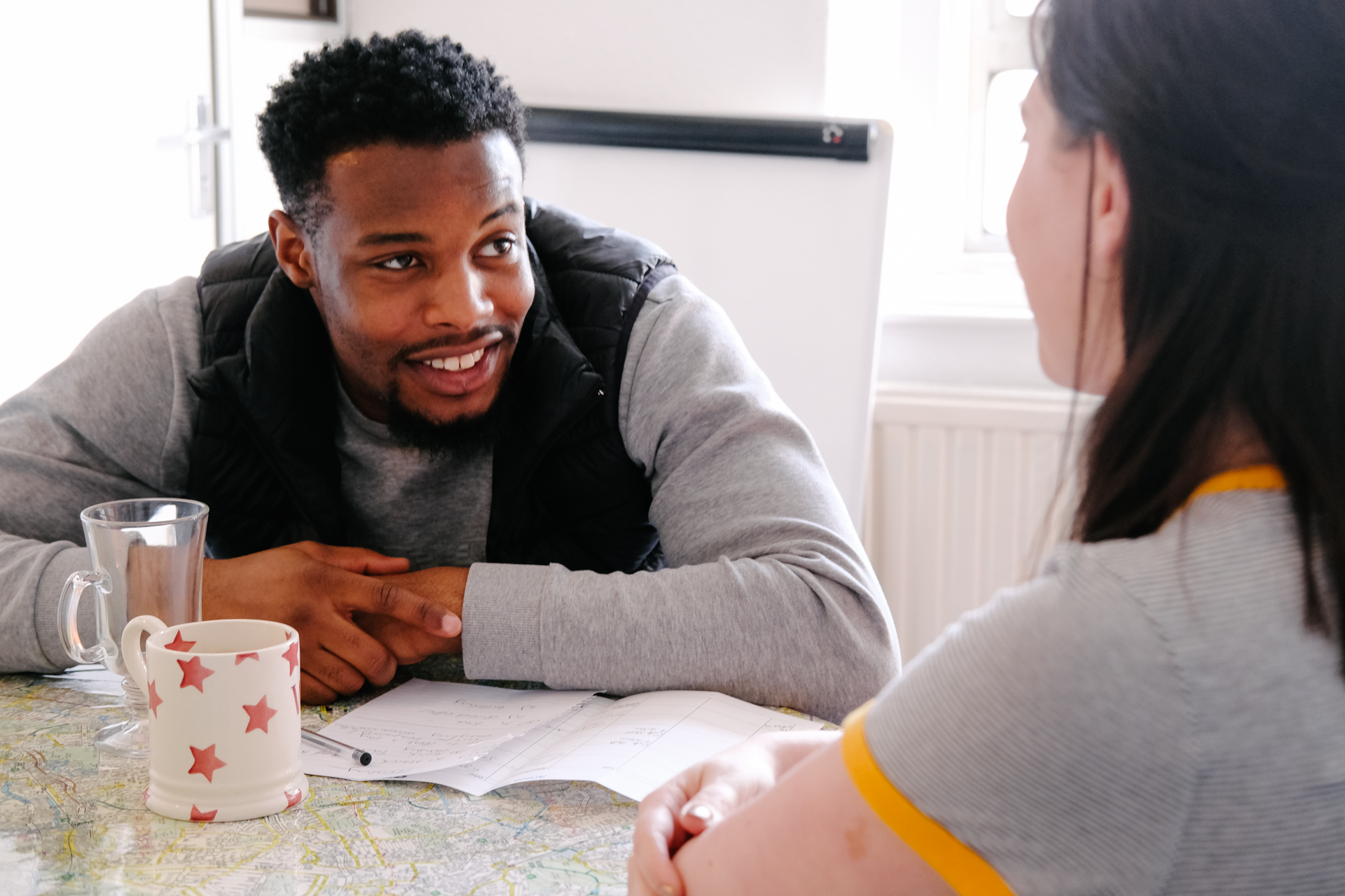 A Switchback Trainee talking with his Switchback Mentor over a cup of tea